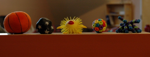 Five toys on ledge